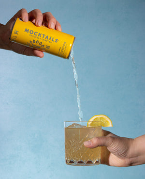 Mockscow Mule mocktail poured over ice with a lemon wedge garnish in a rocks glass.