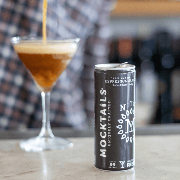 Espress0% Martini mocktail poured into a coupe glass with creamy nitro foam—vegan, non-carbonated, alcohol-free espresso cocktail.