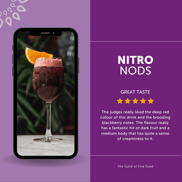 Customer review of Nitro Mocktails Sansgria non-alcoholic cocktail showing dark red alcohol-free sangria with orange slice, rated 5 stars for rich fruit flavor.